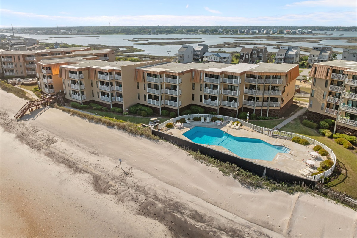 Topsail Dunes, building 2, featuring a sparkling pool just steps from the sand