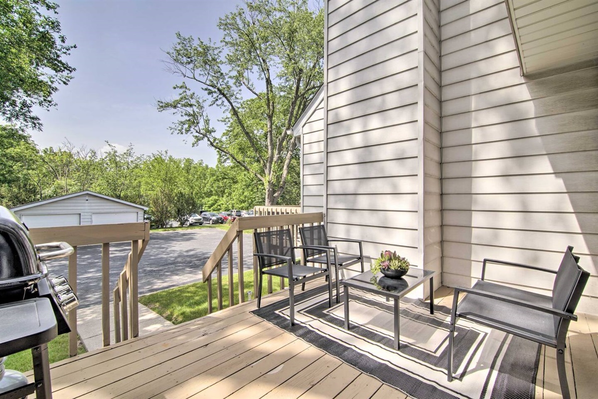 2Br Unit:  The cozy private deck has seating for four and overlooks the spacious back yard and parking area.  Two outdoor parking spaces, plus parking inside the left side of the detached garage, are included.