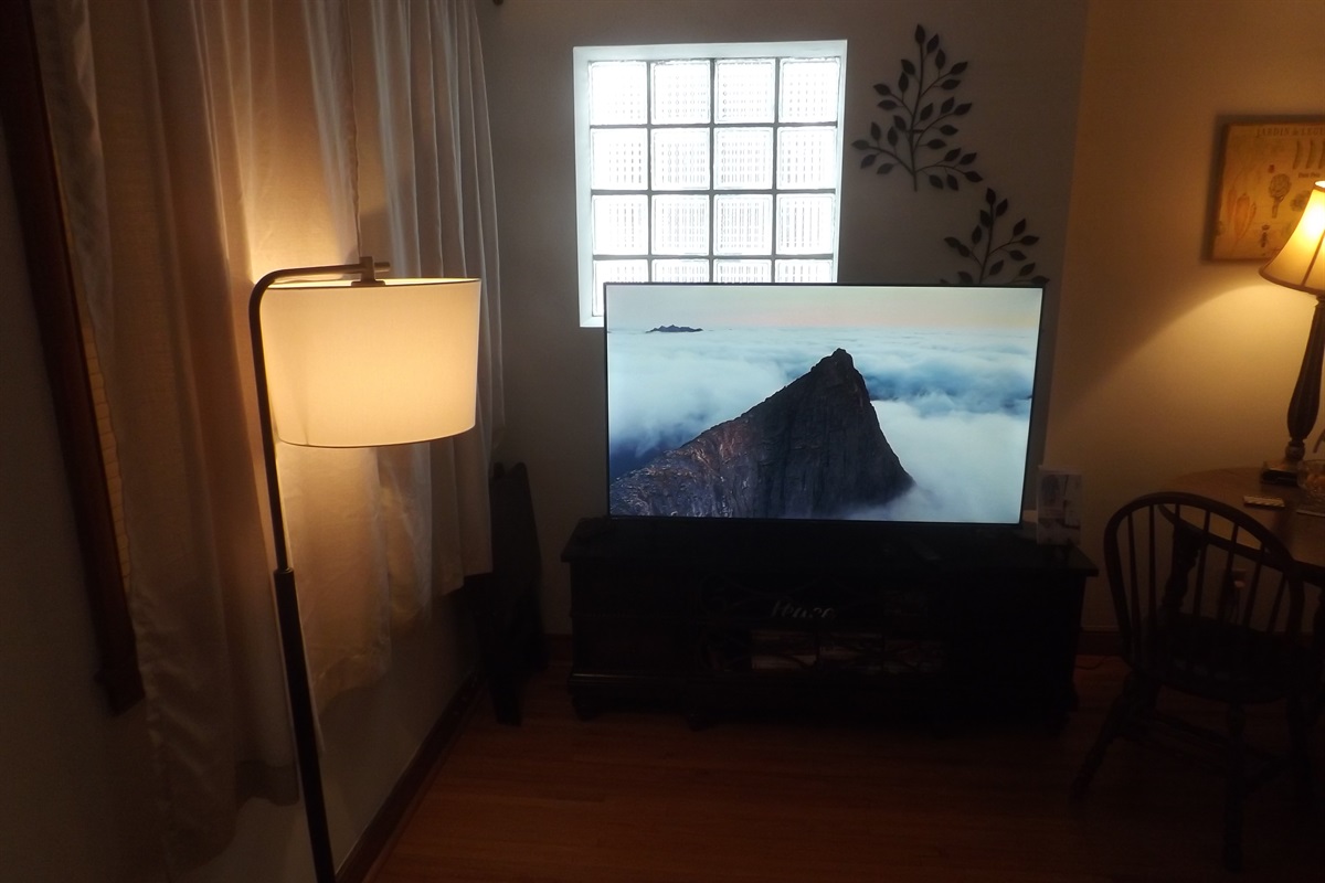 Reclining sofa with large Roku smart TV in living room