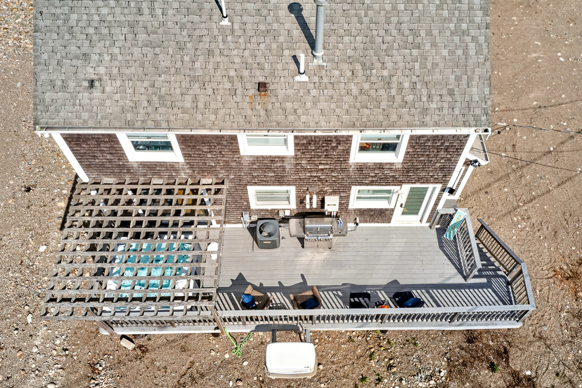 Aerial view of the side deck featuring a shaded pergola area.