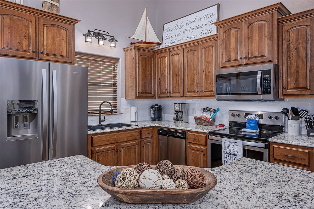 Kitchen stocked with all your cooking and baking needs for any food you may bring.  Large pantry, stainless appliances, and granite