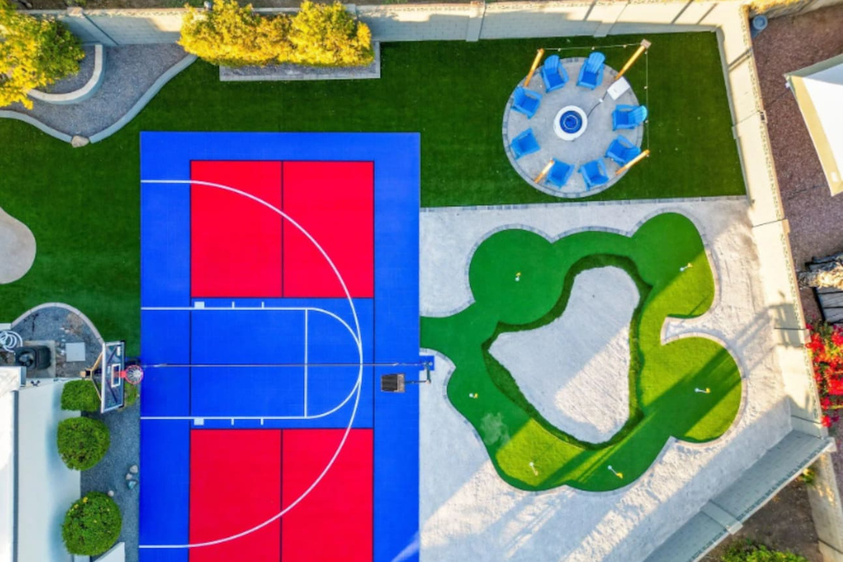 Sport court, putting green, and a shaded dining gazebo — all within a few steps of each other, all yours for the stay.
