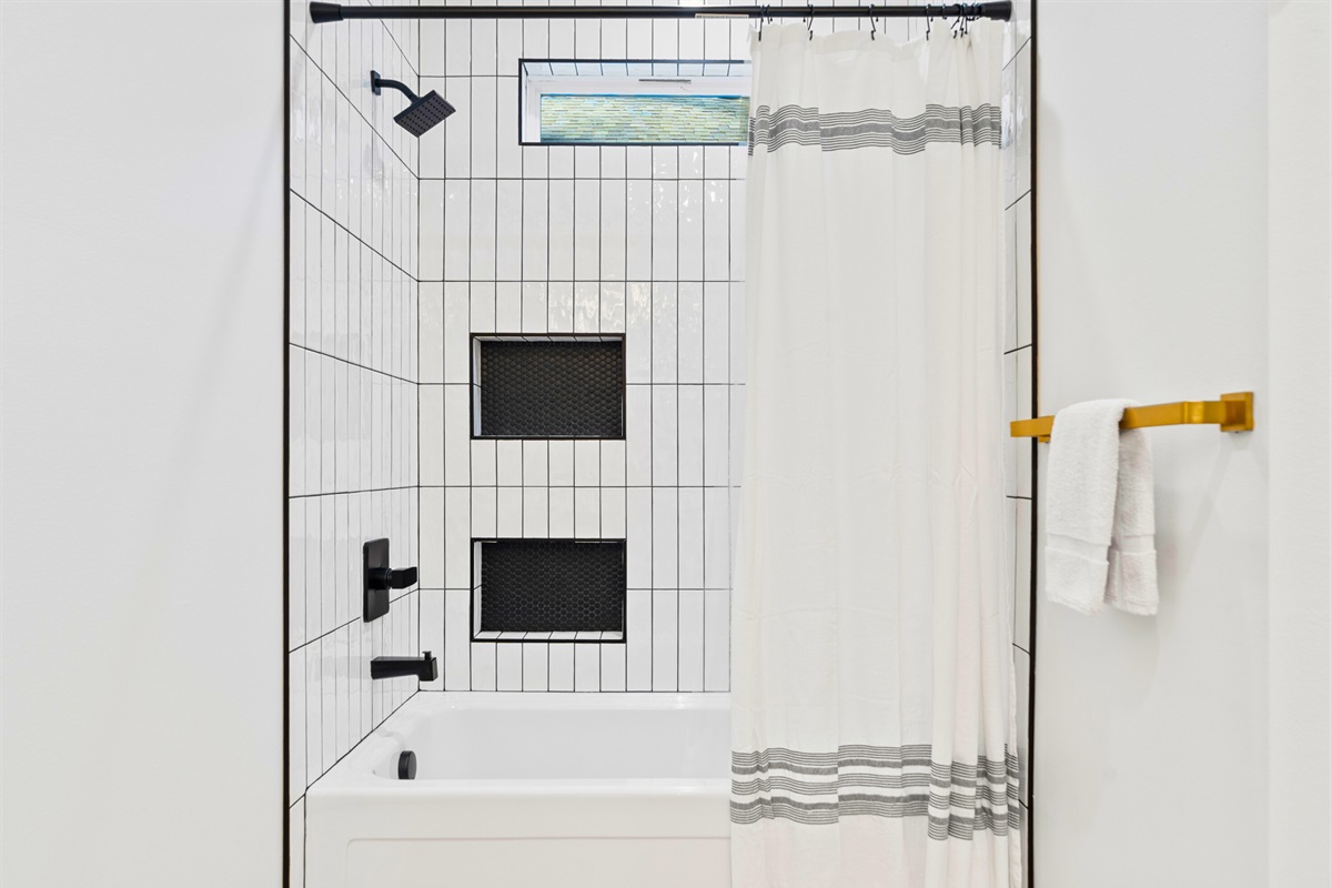 The shower area is clean, simple, and designed for everyday comfort.