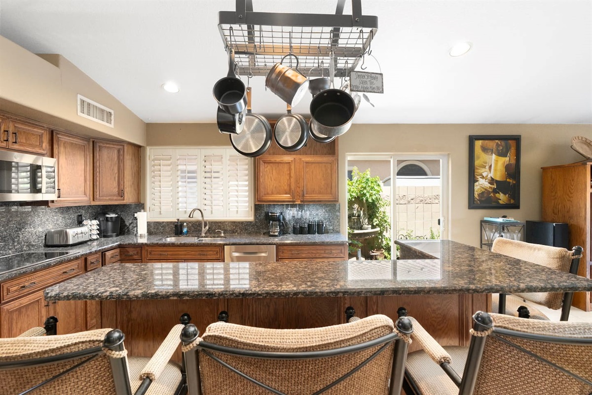 Pull up a seat at the granite island and enjoy casual dining or morning coffee while the chef gets to work — a perfect social hub for the group.