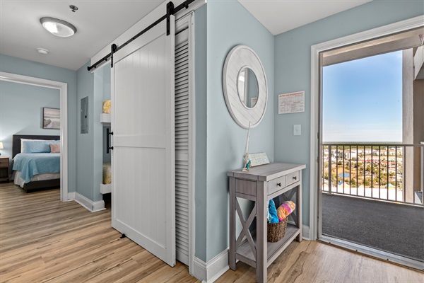 Looking our the front door- down the hall is the bunk room, lakeside bedroom & bath