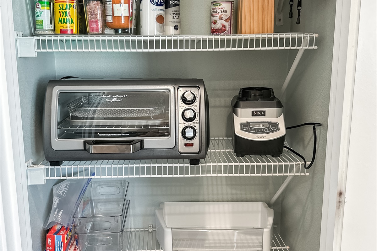 The kitchen is fully stocked with equipment and basic spices.