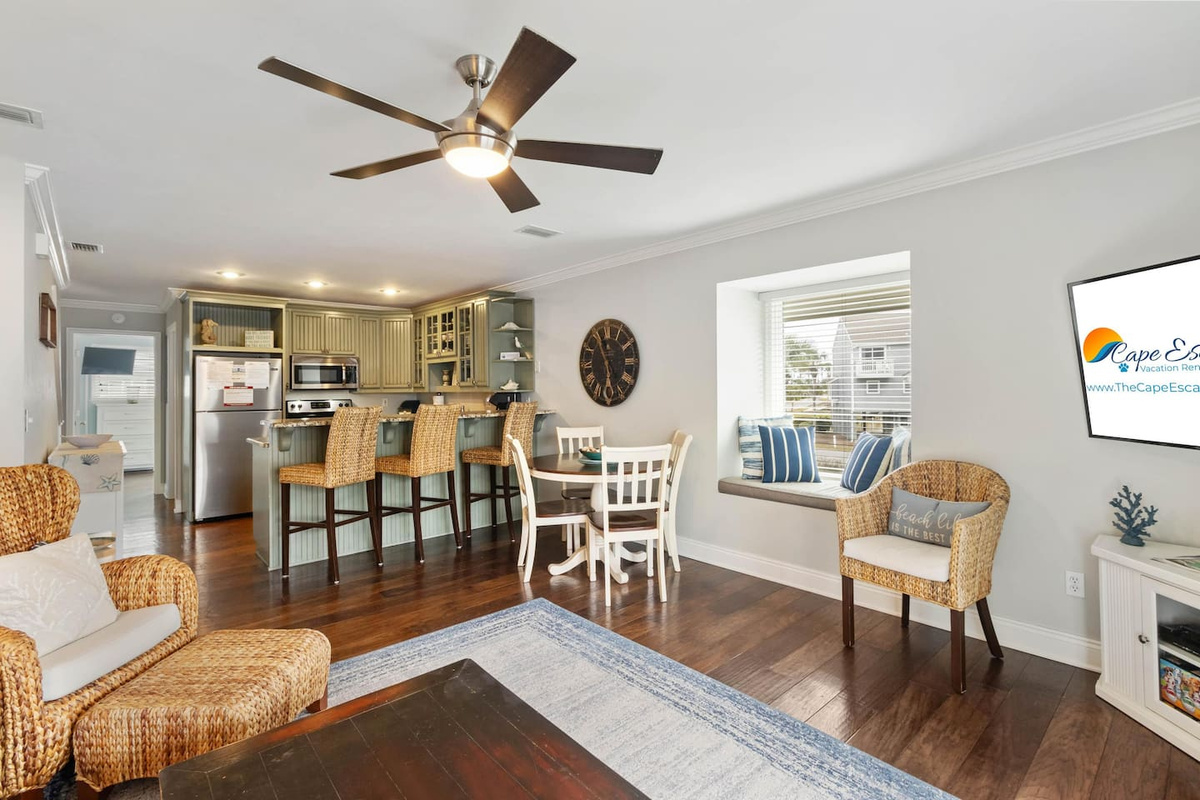  Your open living room keeps everyone connected &mdash; whoever's cooking can still see the Gulf views, hear the conversation, and grab a barstool whenever they're ready.