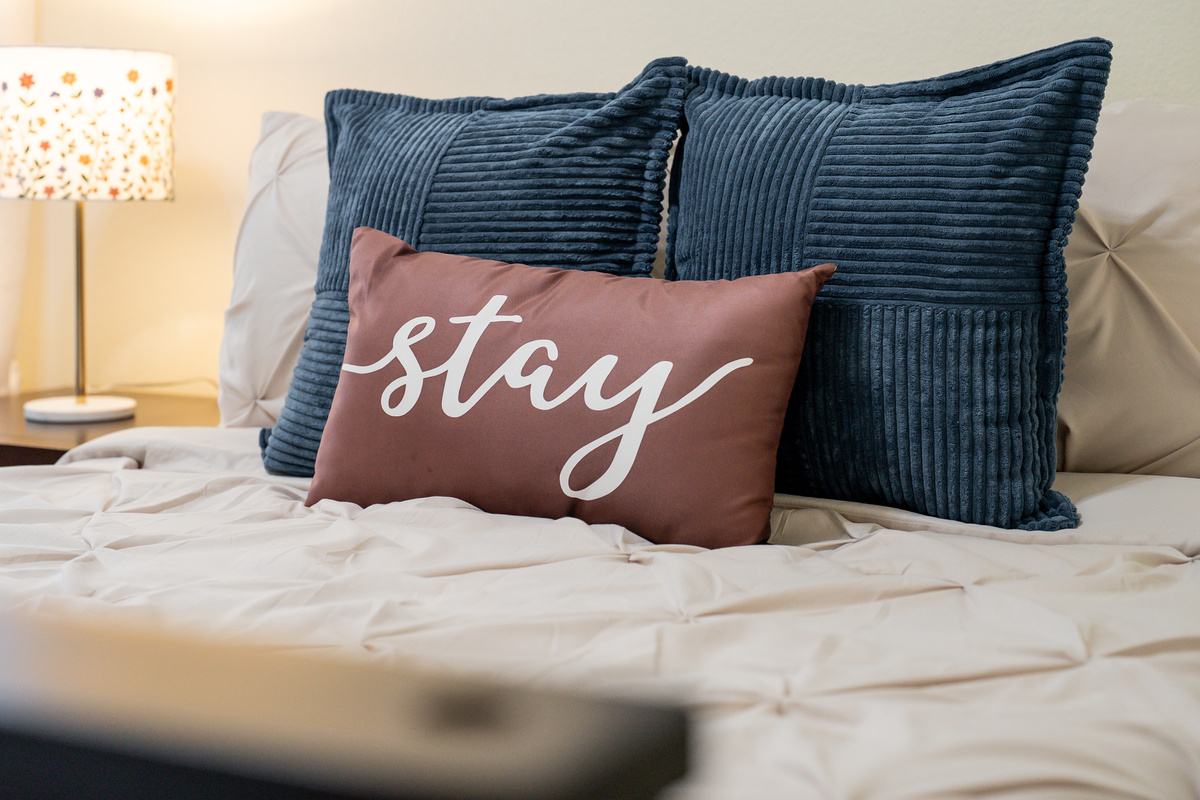 Soft linens, comfortable bedding, and a peaceful atmosphere create the perfect place for a restful night's sleep.