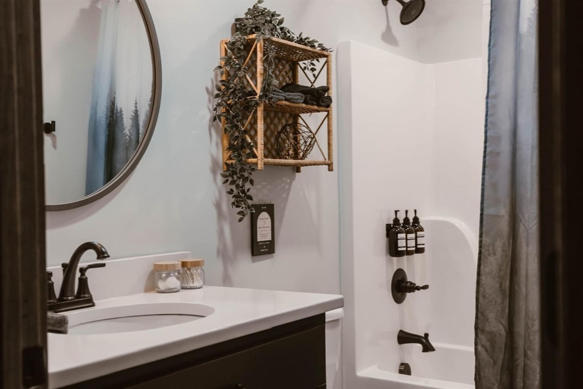 Bathroom, essentials, including shampoo, conditioner, body wash, hand soap, and lotion. Blow dryers in each bathroom.