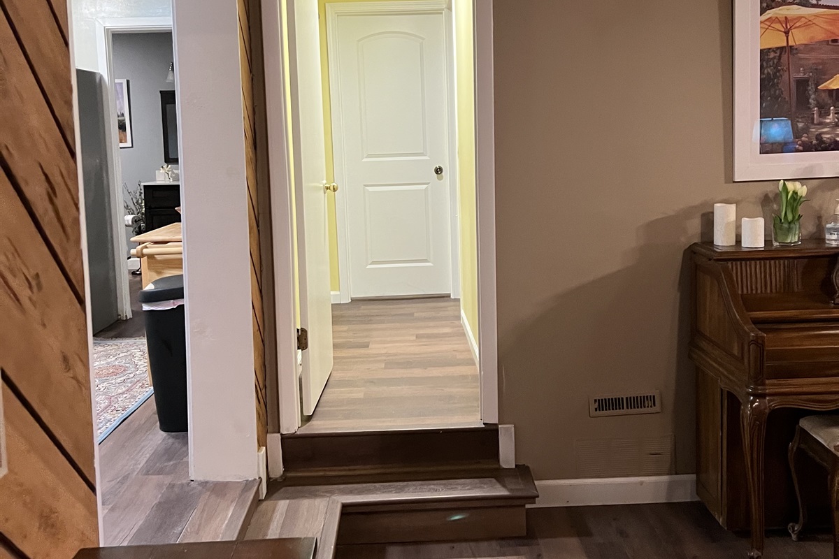 This hallway is just off the kitchen and main room. It leads to bedroom 3 and 4.