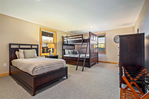 This room offers a fun bunk bed and an additional twin bed, ensuring everyone has their own comfy spot to relax.