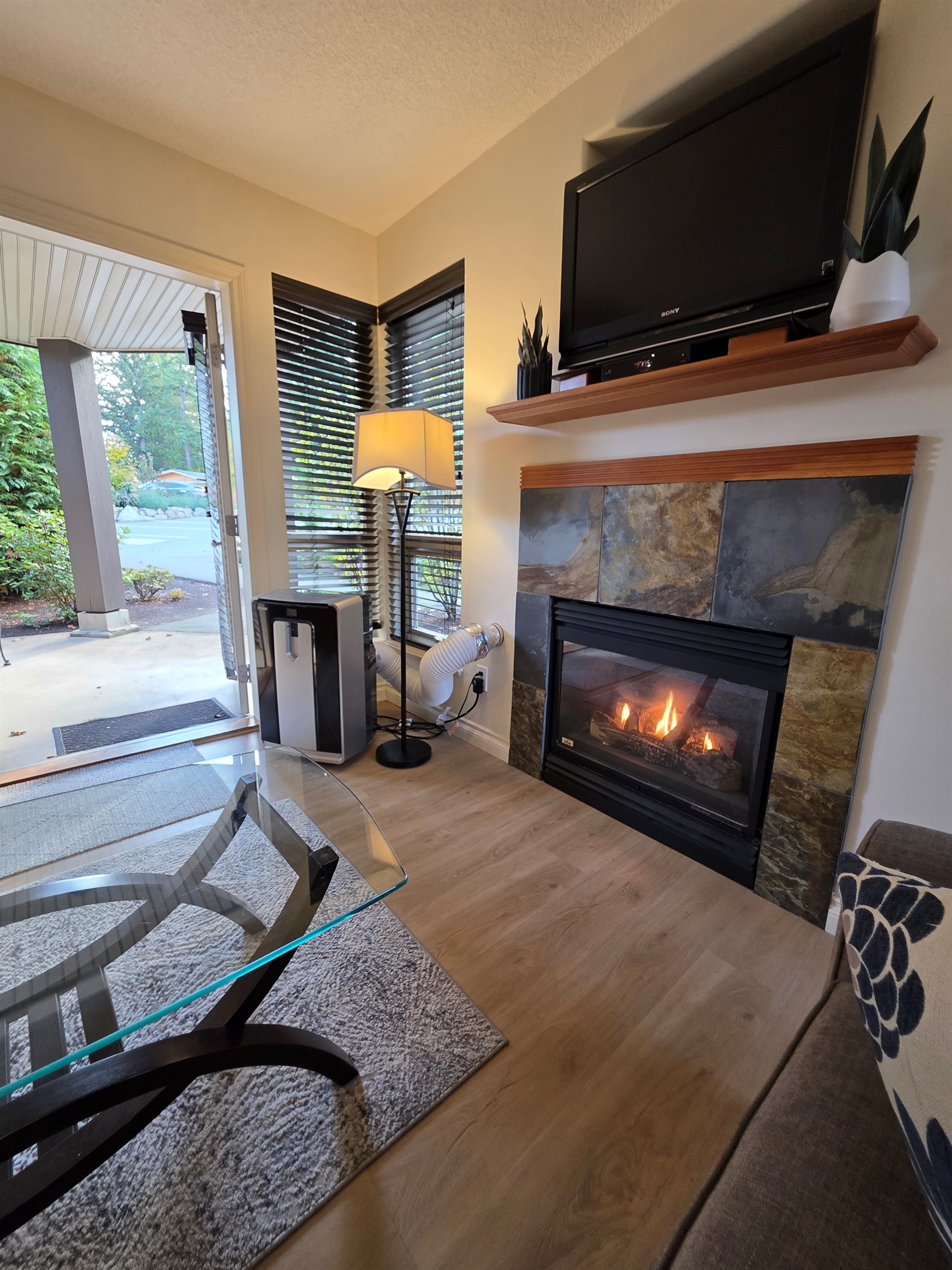 Unit B Natural Gas Fireplace. Double Glass Patio Doors. AC Unit as well!