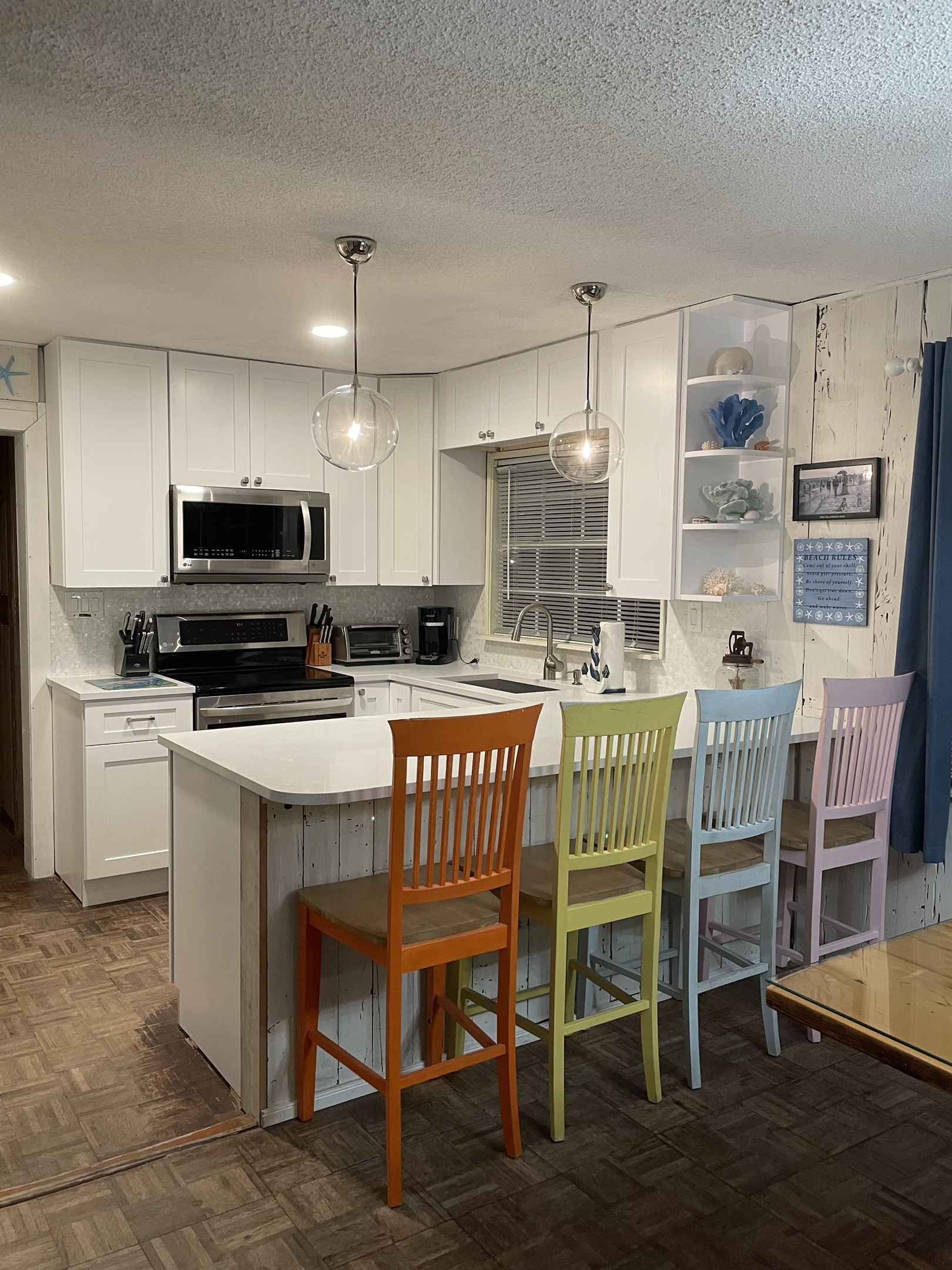 Open concept kitchen and breakfast bar,  Quartz Counter Tops, Mother of Pearl Backsplash, Restoration Hardware Pendant Lights