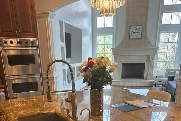 A chef’s kitchen Great for preparing and cooking food huge marble granite top with Viking appliances 
