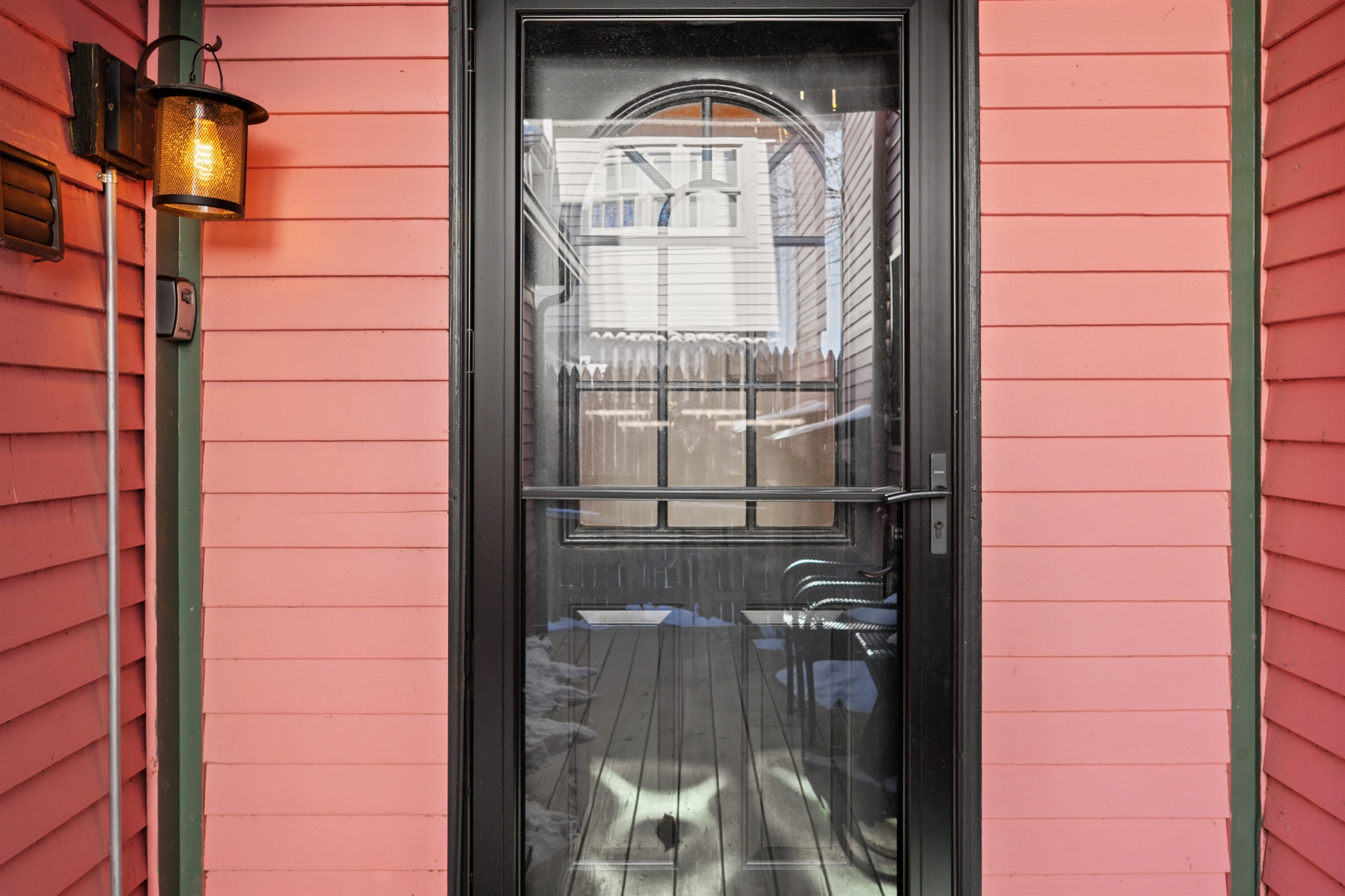 The iconic pink and black building of A Little Mad Shop marks the entrance to your downtown retreat.