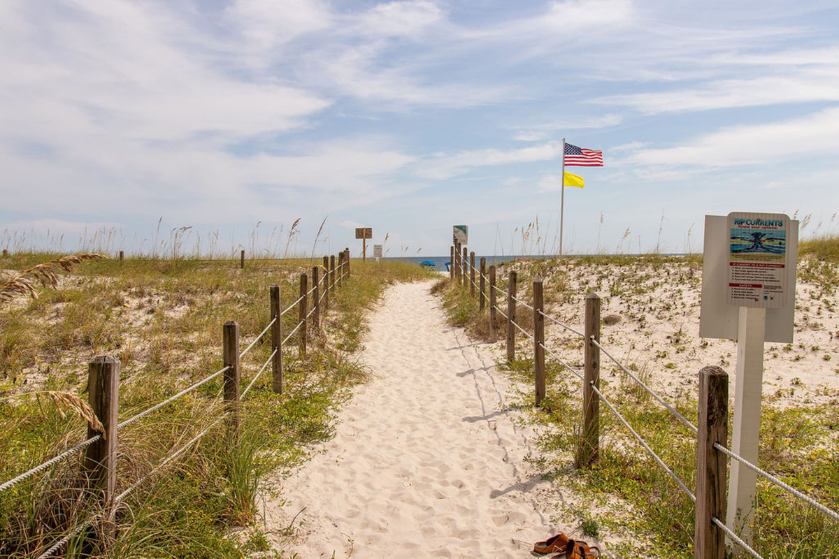 Beach access walkway - Beach access just steps from the condo