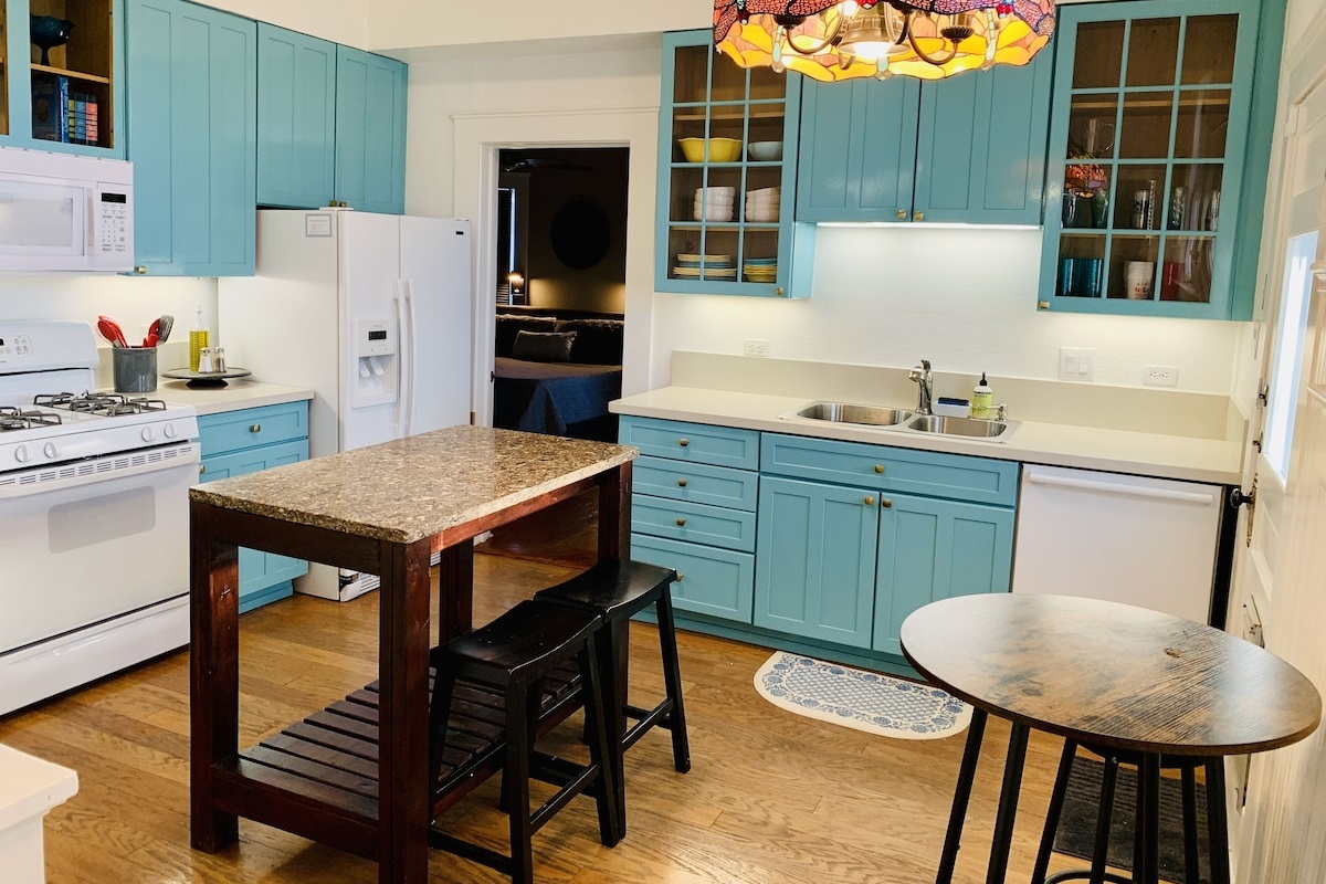 The kitchen is authentic and includes an original hutch and modern appliances. 