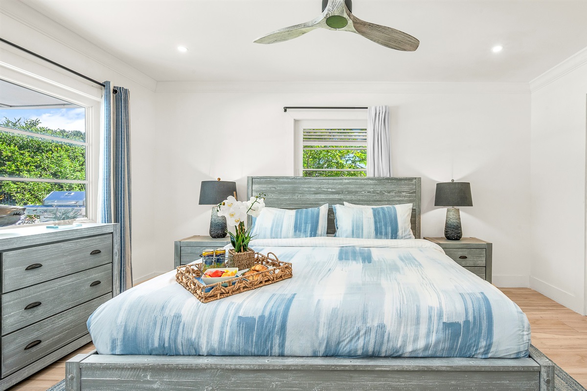 Primary Suite: King-size Tempur-Pedic Pro Adapt mattress, en-suite bath with dual-sink vanity. Pool views. 