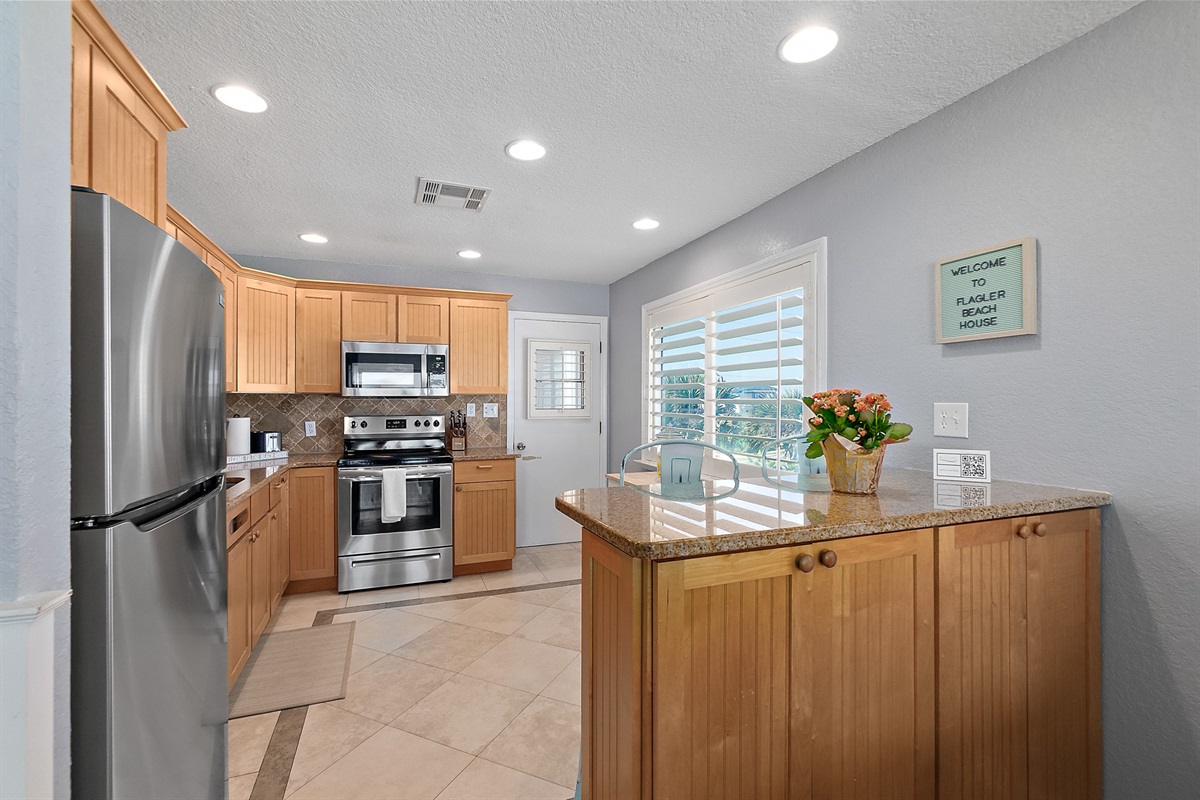 Fully equipped kitchen with stainless appliances