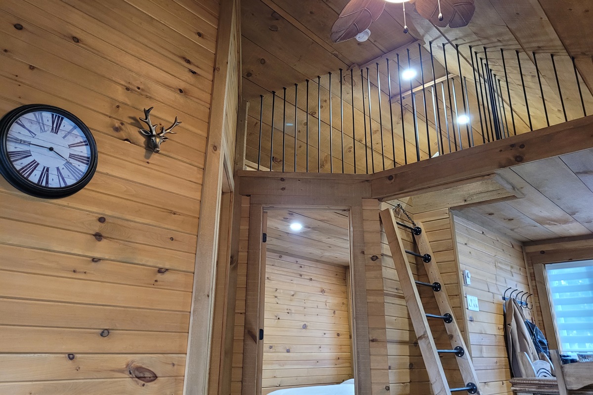 Access ladder and view of sleeping loft from main floor