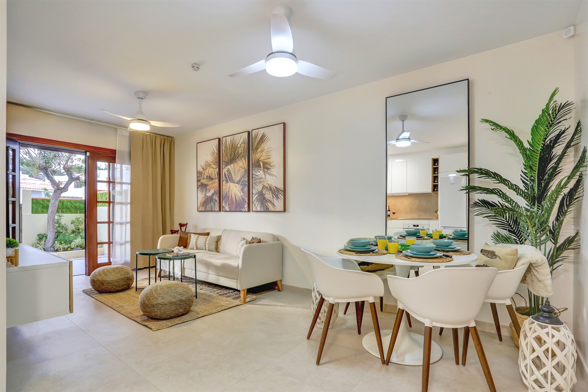 Spacious and bright open-plan living and dining area with elegant décor and a welcoming atmosphere - perfect for sharing and enjoying time together.