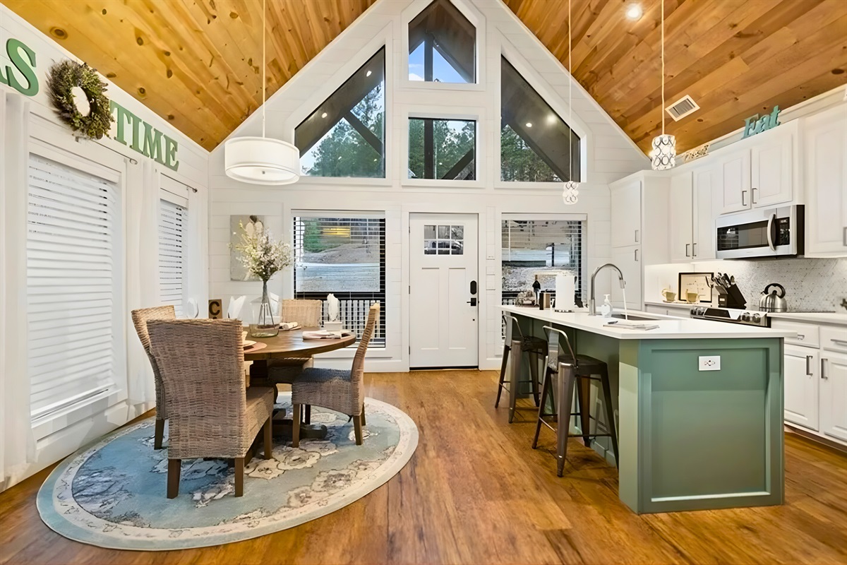 With soaring ceilings, natural light, and an easy flow between the dining area and kitchen, this space is perfect for shared meals, morning coffee, and lingering conversations.