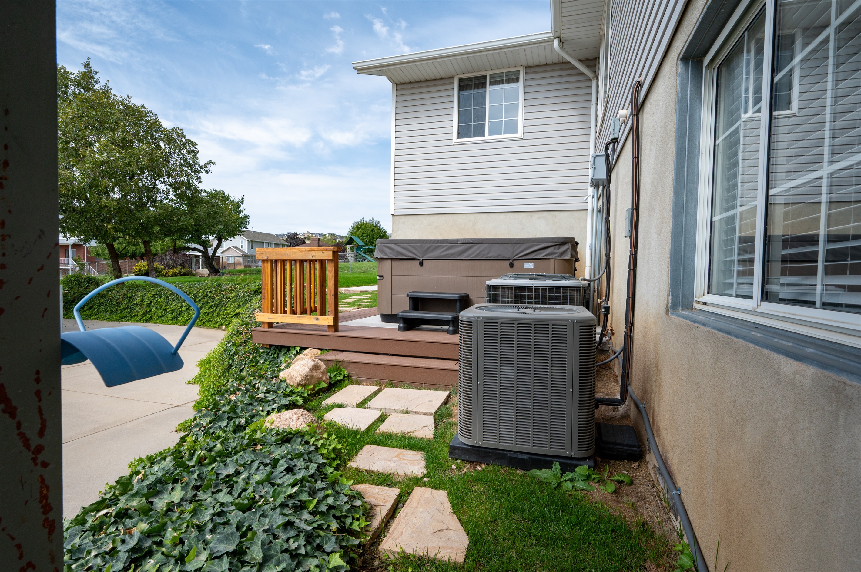 Spacious patio area with a private hot tub.