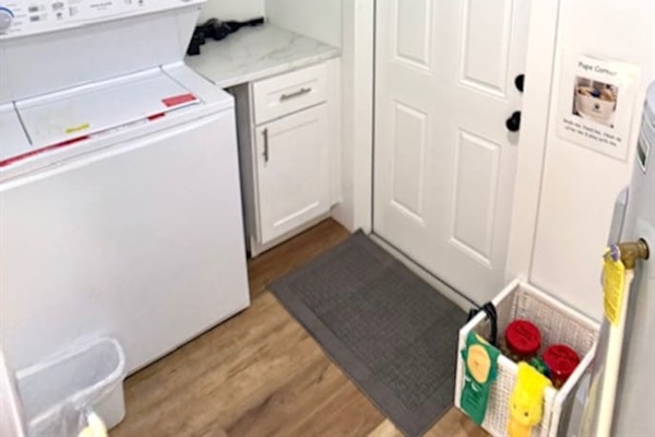 Laundry room with doggie water/food bowls and toys