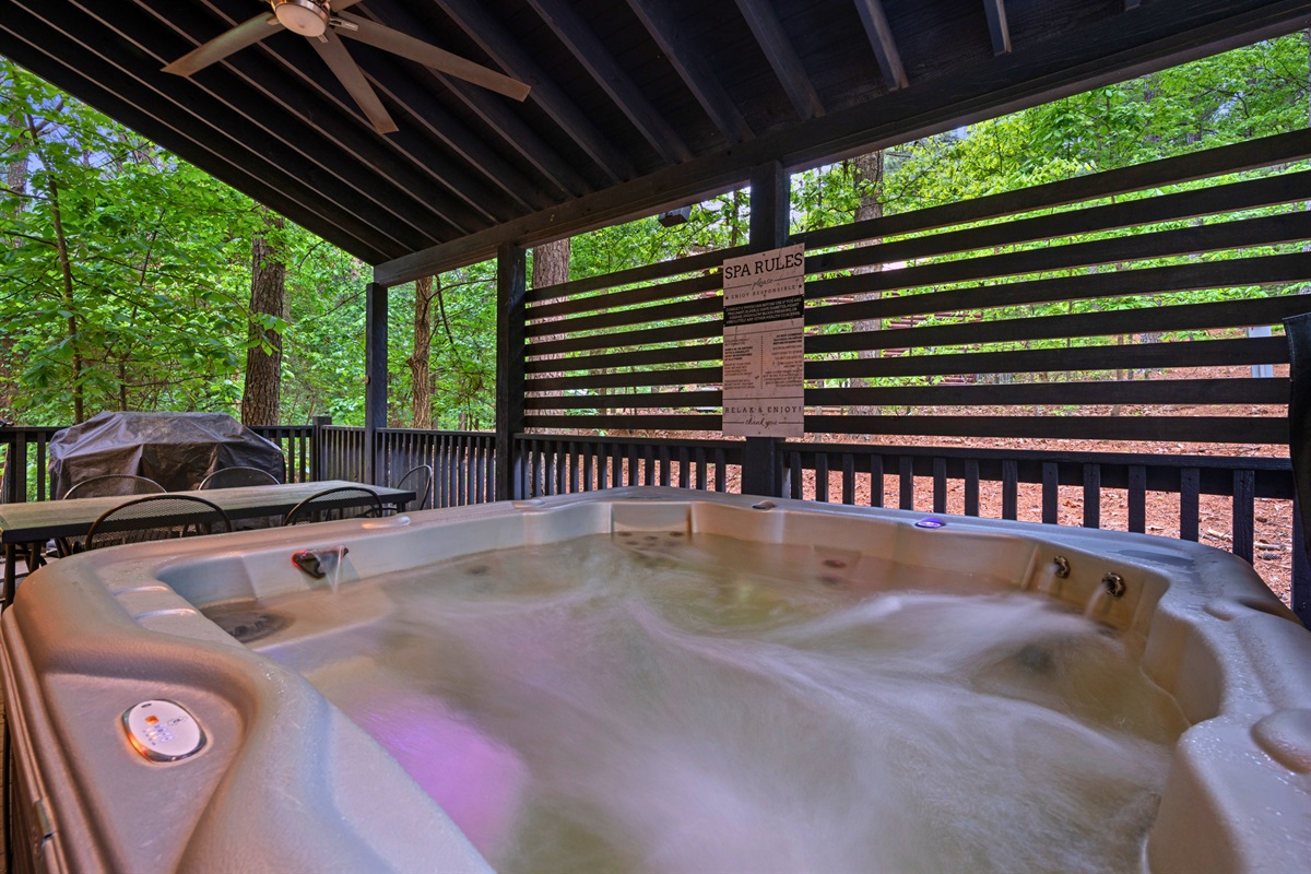 There’s something especially relaxing about slipping into the hot tub on this covered deck, where you can enjoy the outdoors no matter the weather.
