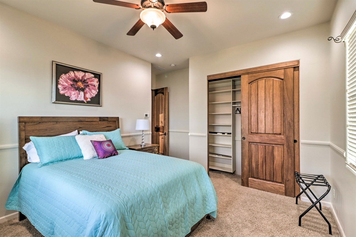 Bright queen bedroom on the main level with easy access to nearby full bathroom and shared living spaces