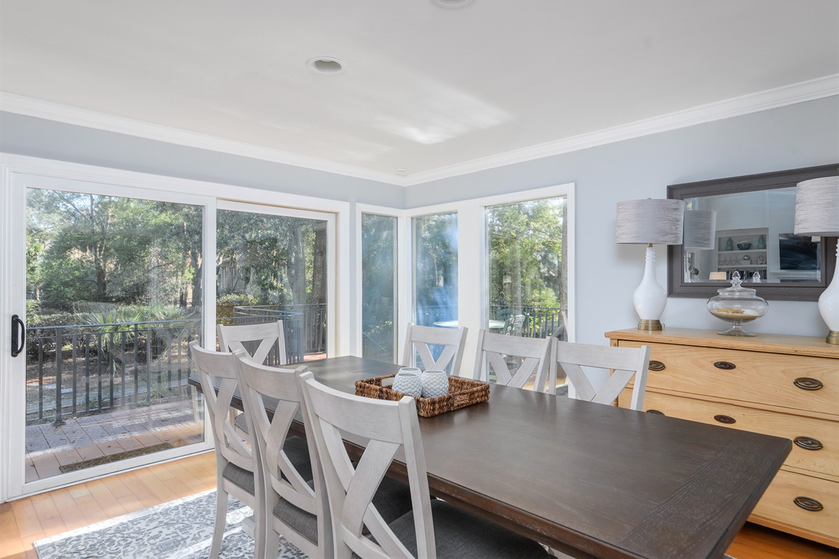 Dining room out to wrap around deck and pool