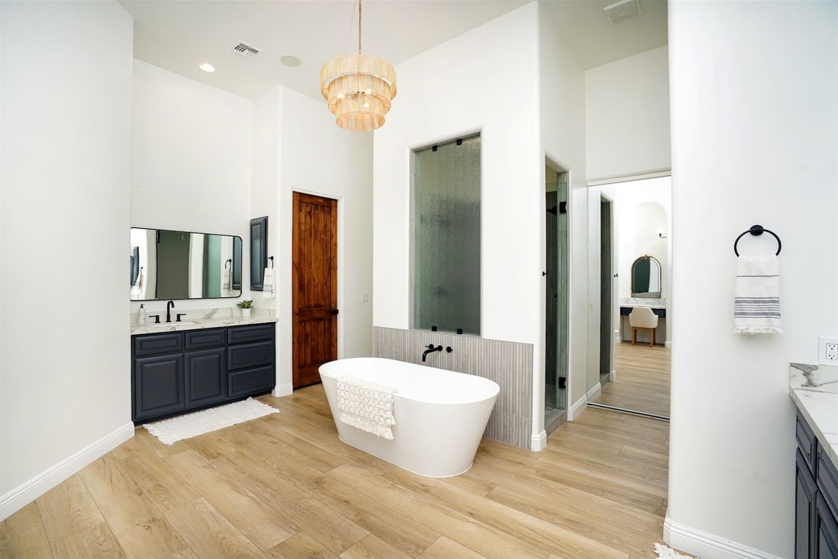 Owner's Suite bathroom with soaking tub and dual showers.