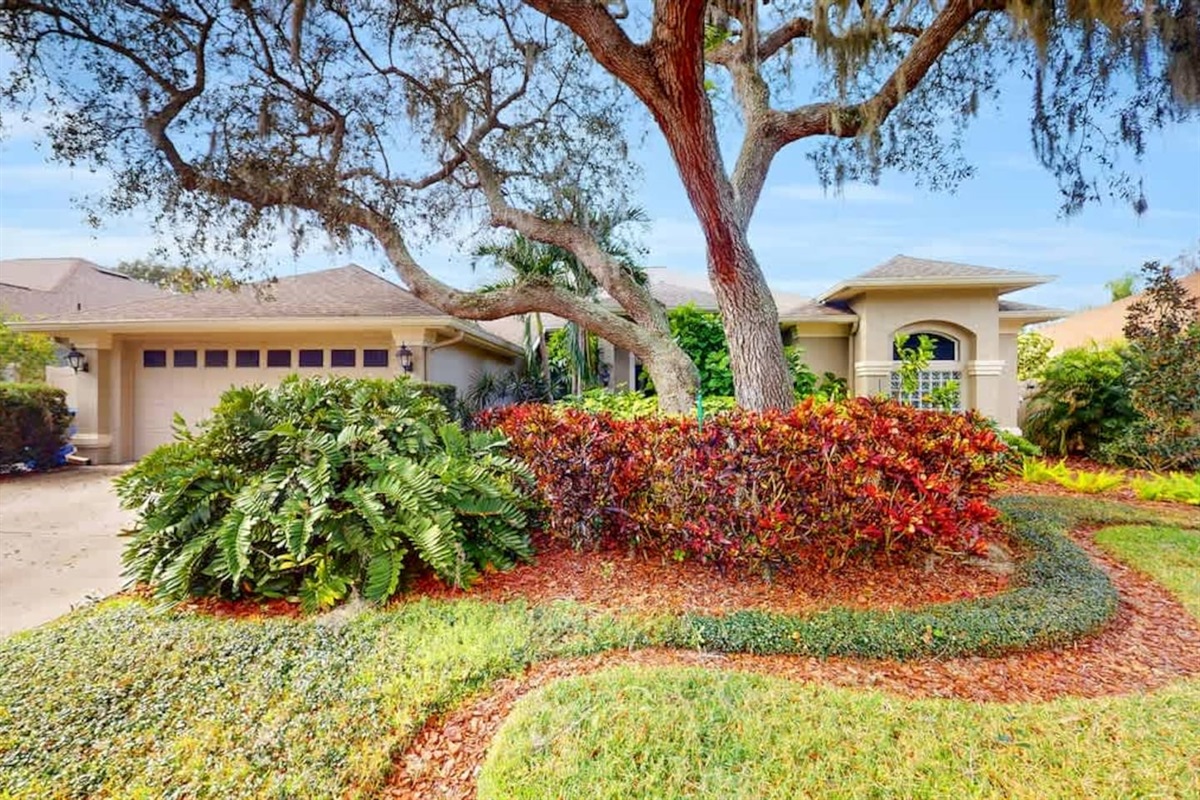 Colorful landscaping creates a warm front-yard welcome.