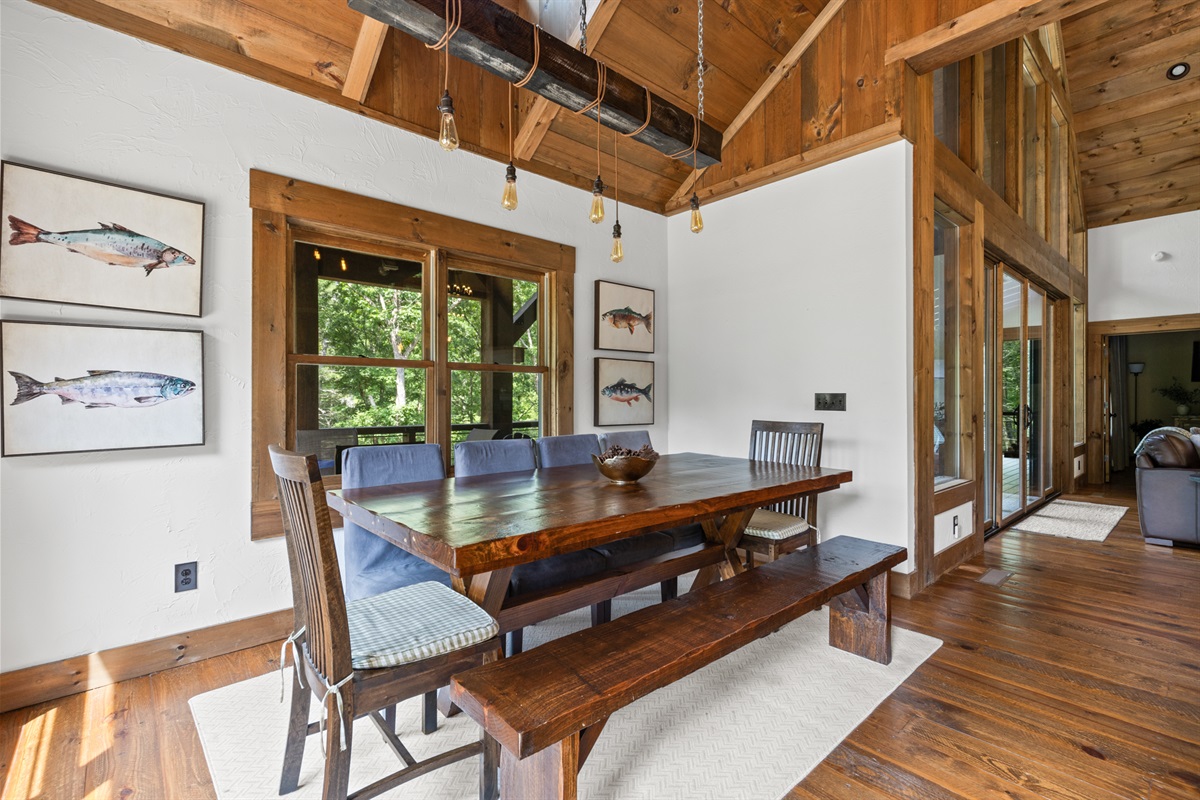 Host memorable dinners with a view at this expansive dining table, surrounded by the warmth of rustic design.