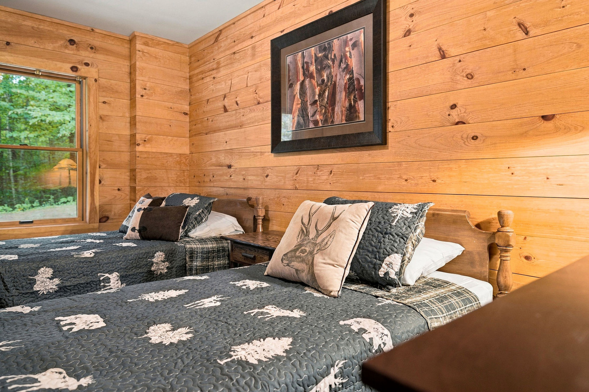 A comfortable bedroom with two twin beds is ideal for children, friends, or additional guests.