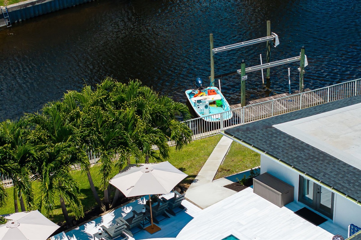 Enjoy your own private slice of paradise with sparkling lakefront views, a private dock, and direct water access—perfect for paddleboarding, kayaking, or simply soaking in the Florida sunshine by the pool.