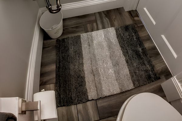 "Havre" bathroom includes cabinet above the bathroom sink and magnifying mirror