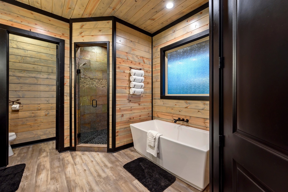 Gorgeous master bath with walk in shower and soaker bathtub.