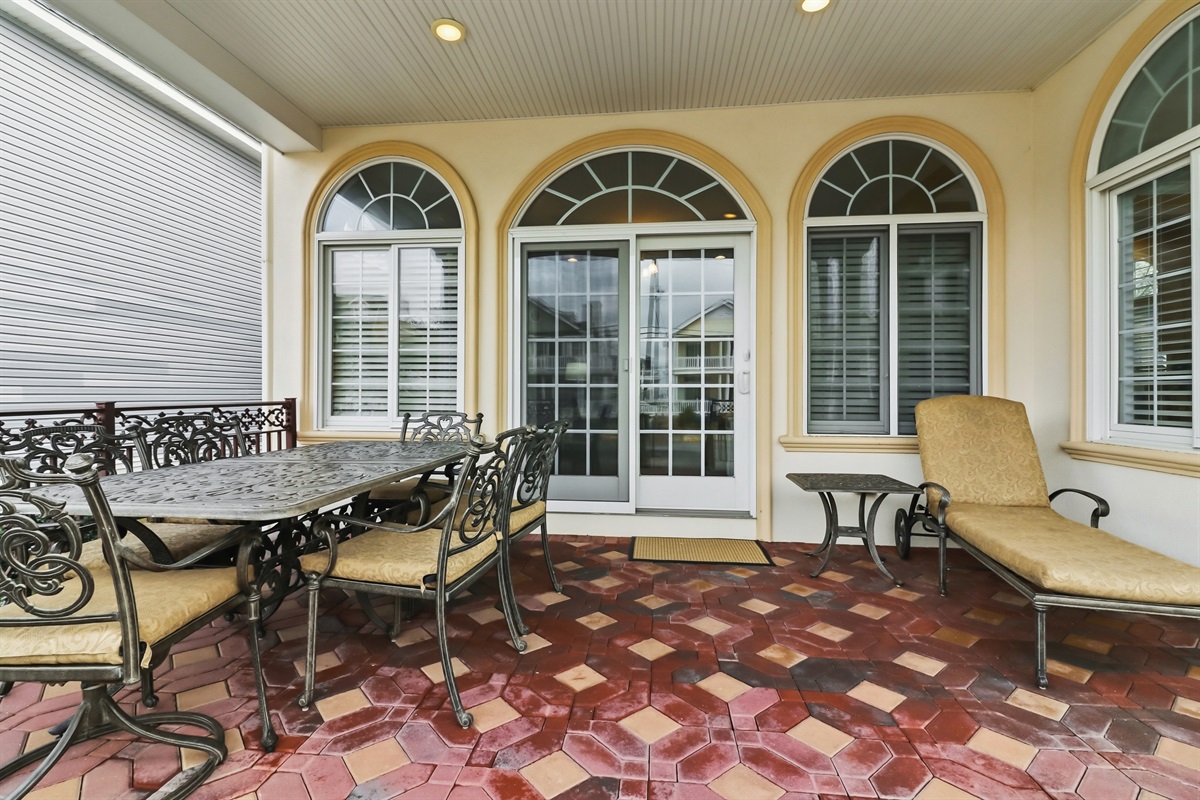 Covered balcony with outdoor dining and lounging