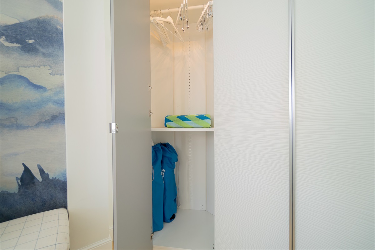 His/Her closets with beach towels and beach chairs. Beach umbrella on the side.  All you need for a day in the Florida sun.