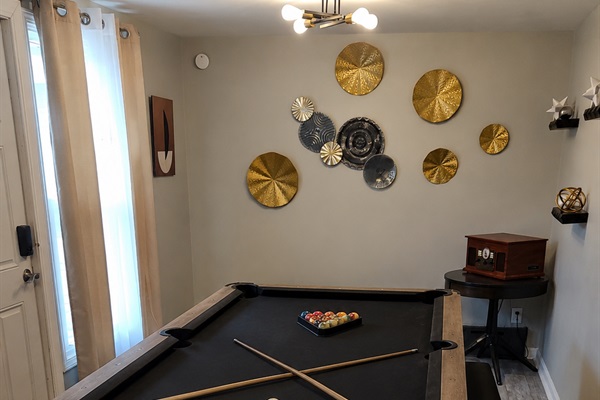 Dining table also doubles as a pool table for additional entertainment