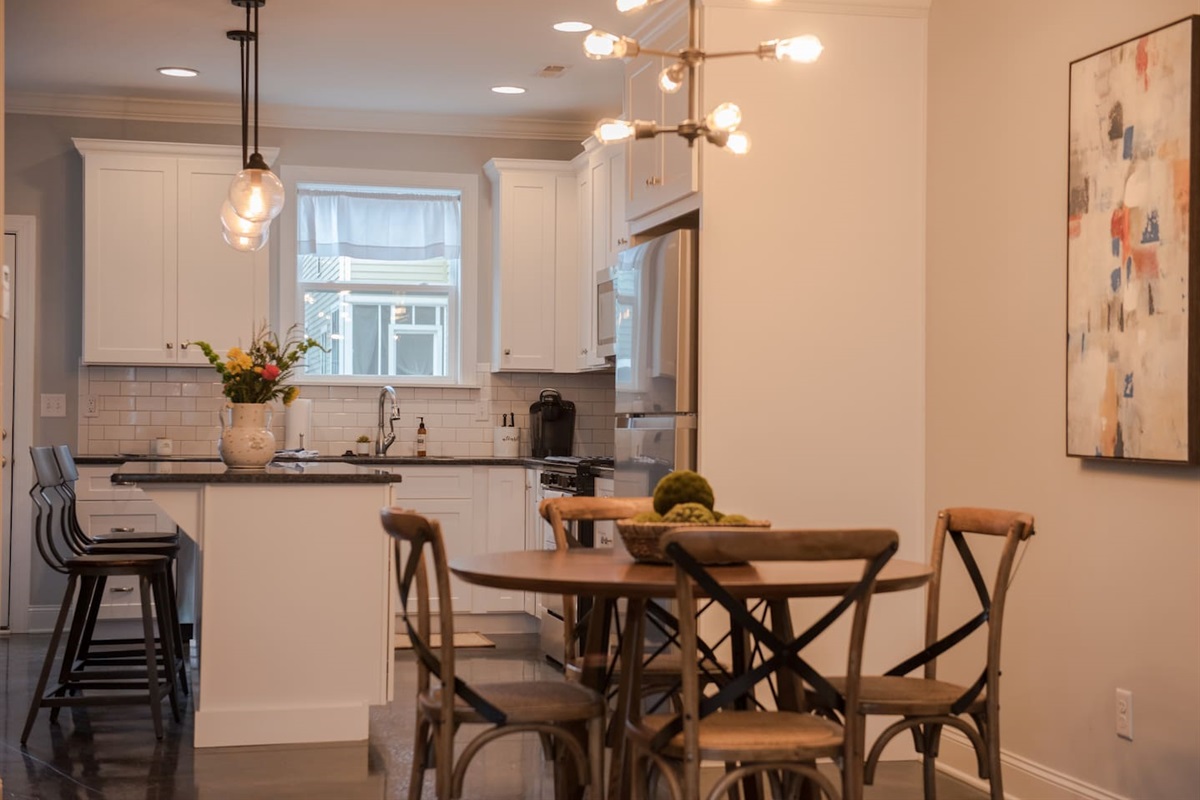 modern kitchen with dining table and bar