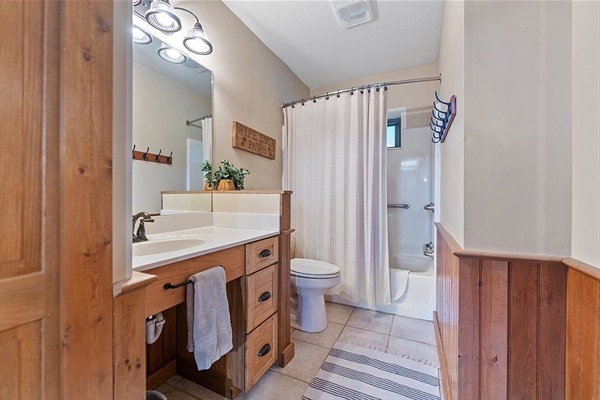Upstairs shared full bath w/ tub/shower combo and stability bars for support
