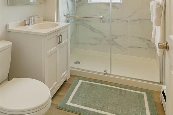 Bright, professionally cleaned bathroom with fresh towels and guest essentials included.