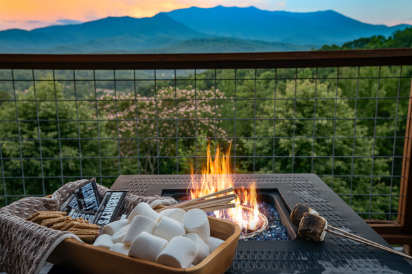 S’mores and unobstructed Smoky Mountain Views at the fire pit on the main level back deck overlooking the Smokies