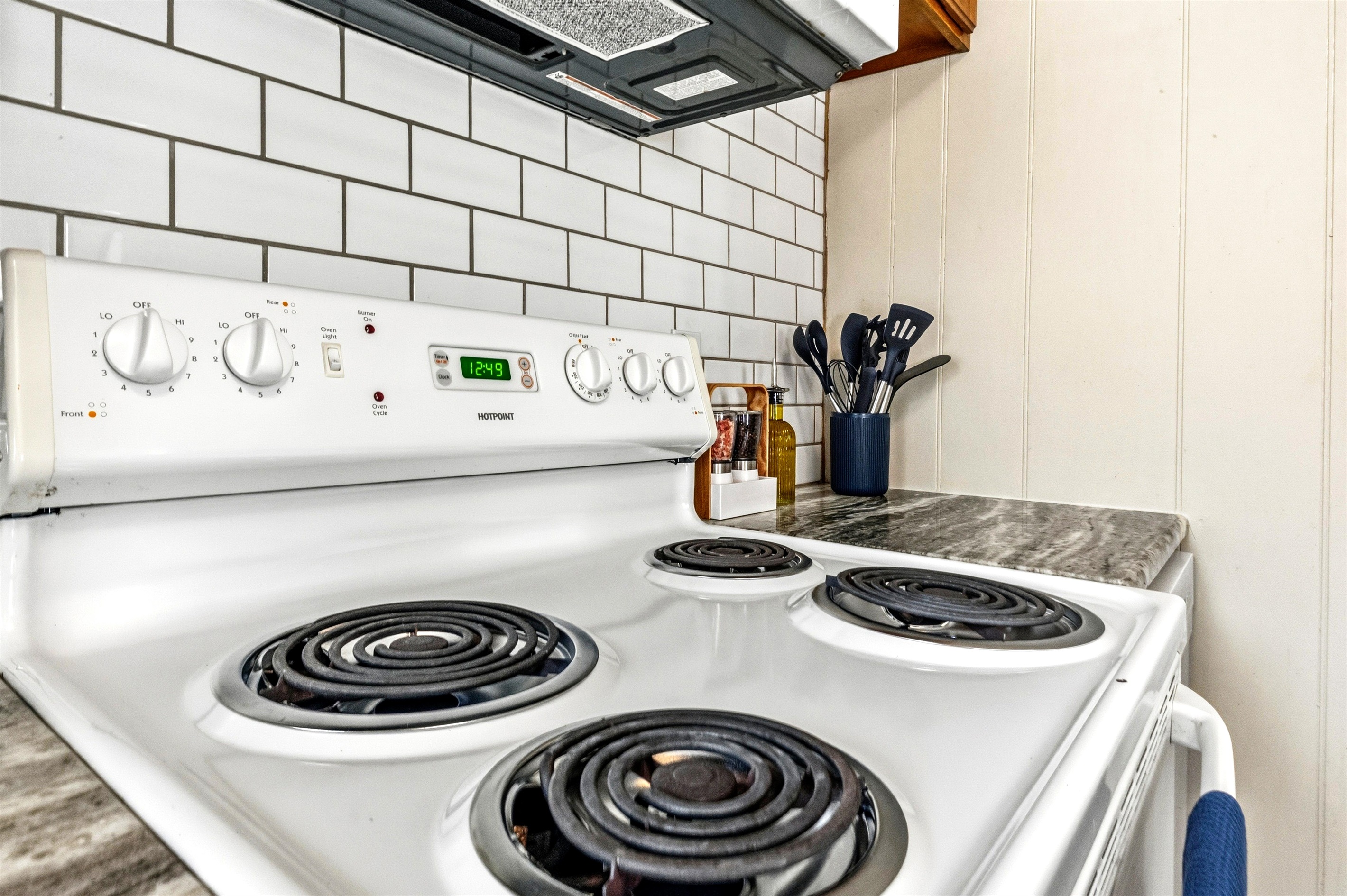 The kitchen includes a full-size stove as well as plenty of pots and pans.