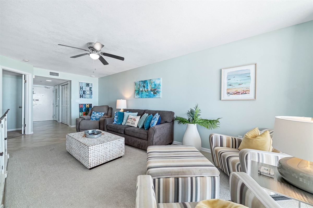 Spacious living area with a sleeper sofa and direct balcony access to the beach. Your ideal vacation retreat!