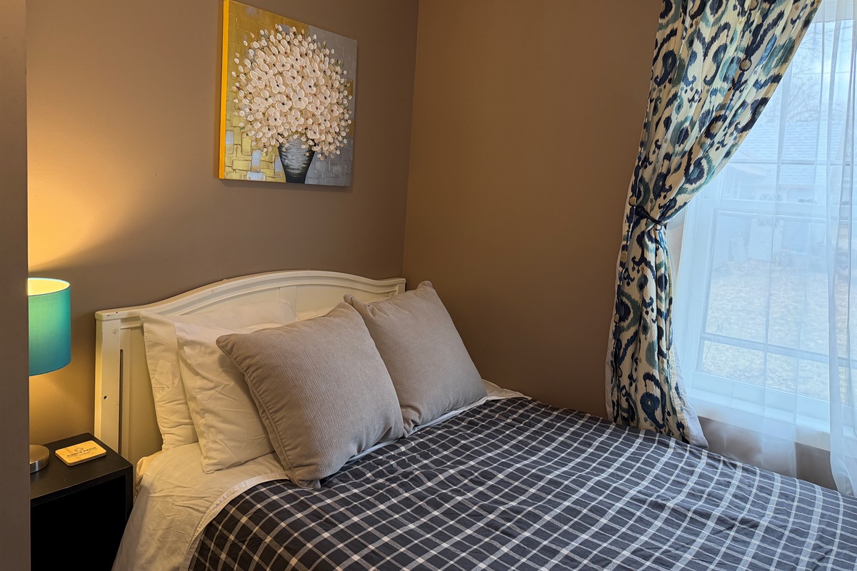 The full bed is cozy and comfortable.