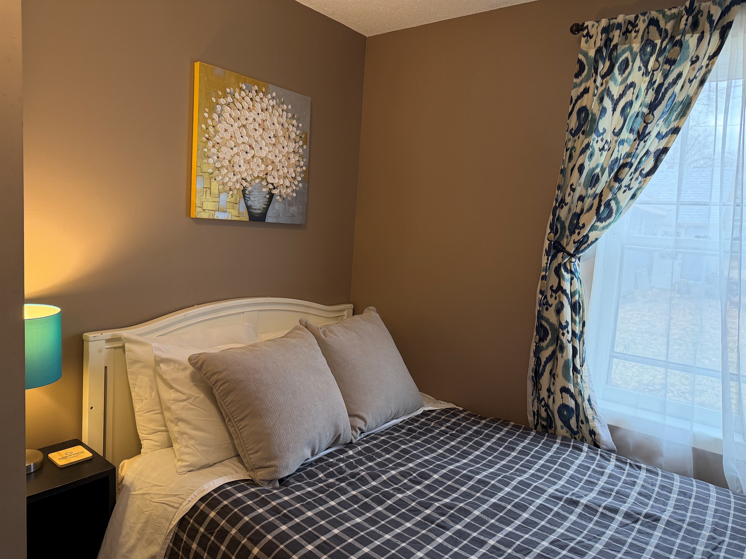 The full bed is cozy and comfortable.