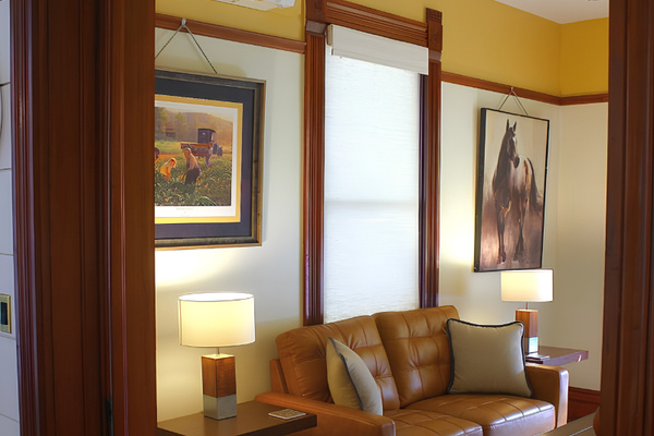 Original historic pocket doors usher guests from chef's kitchen to living room